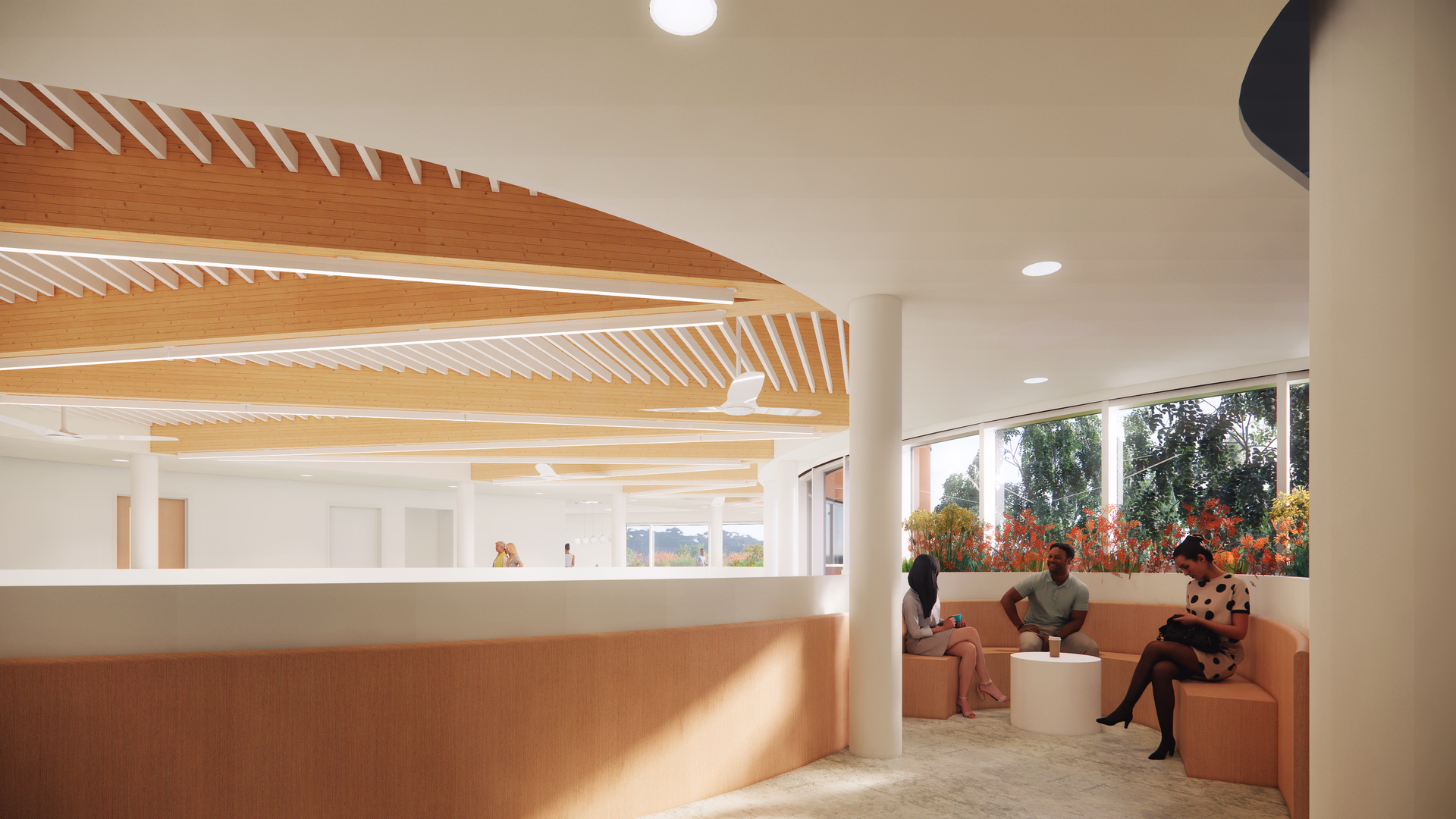 Modern curved seating area with three people sitting around a white round table near large windows with plants outside.