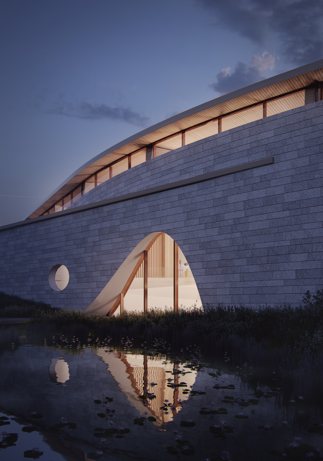 Modern stone building with curved arch window reflecting in water at dusk.