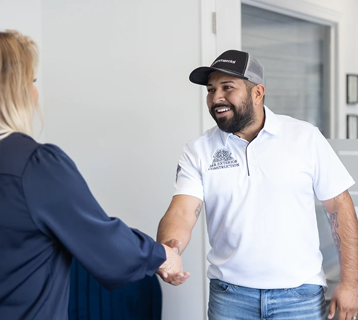 Roofer meeting insurance agent.