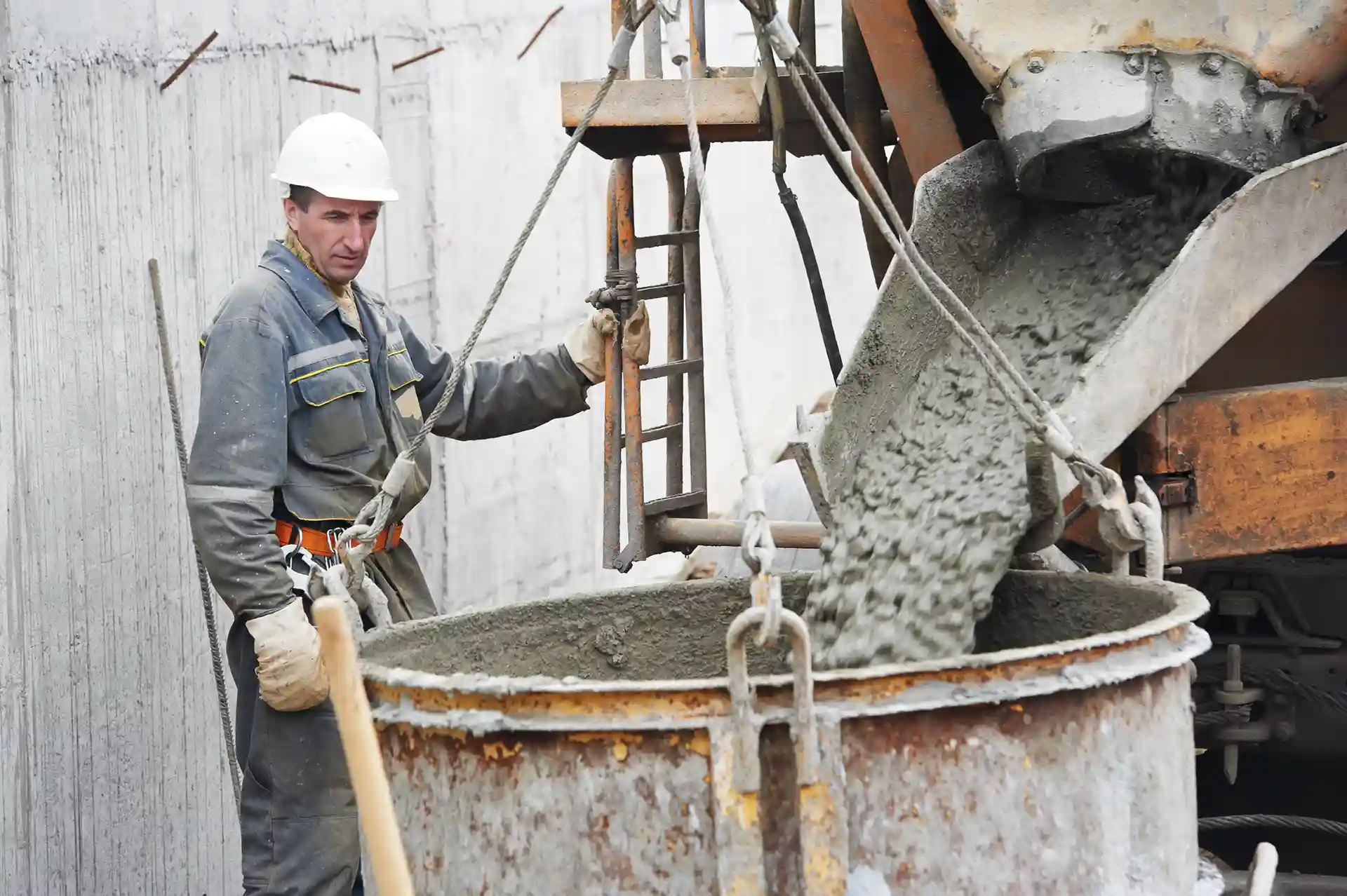 Man holding concrete bucket.
