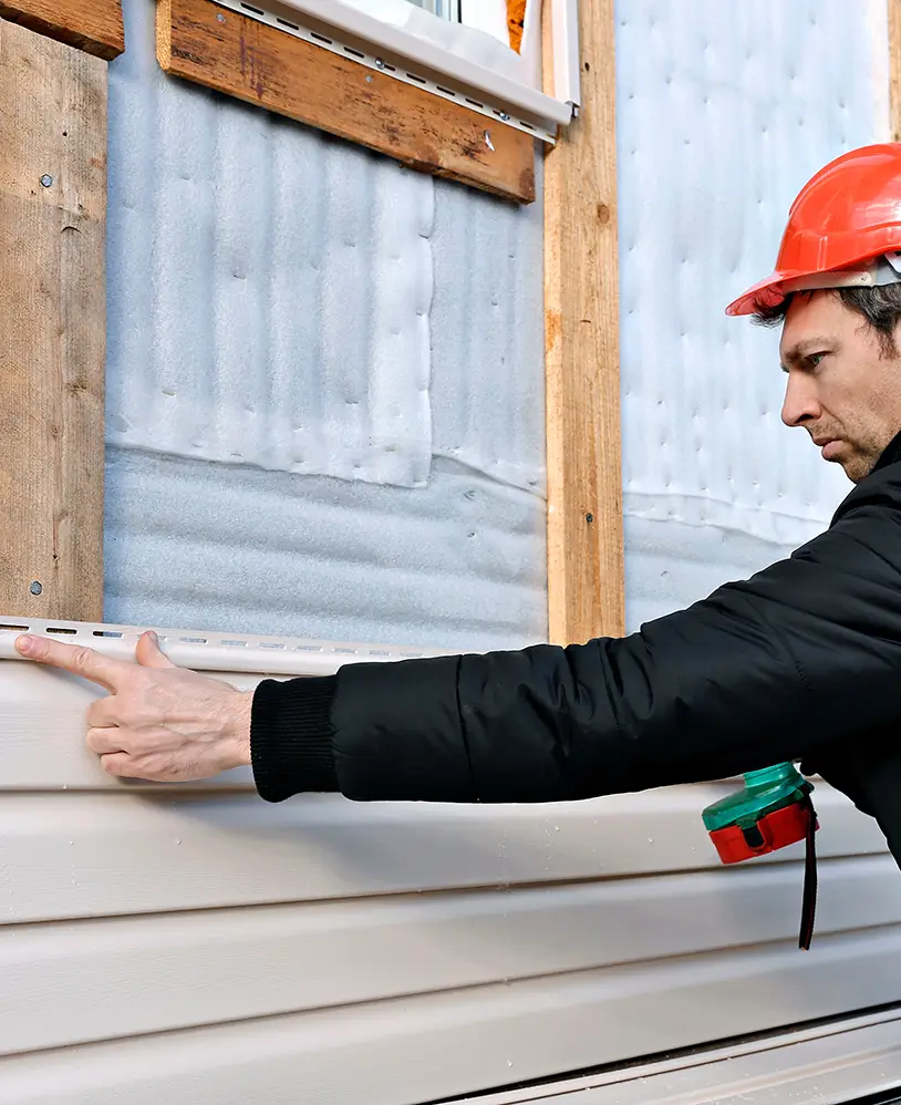 Siding installer working.
