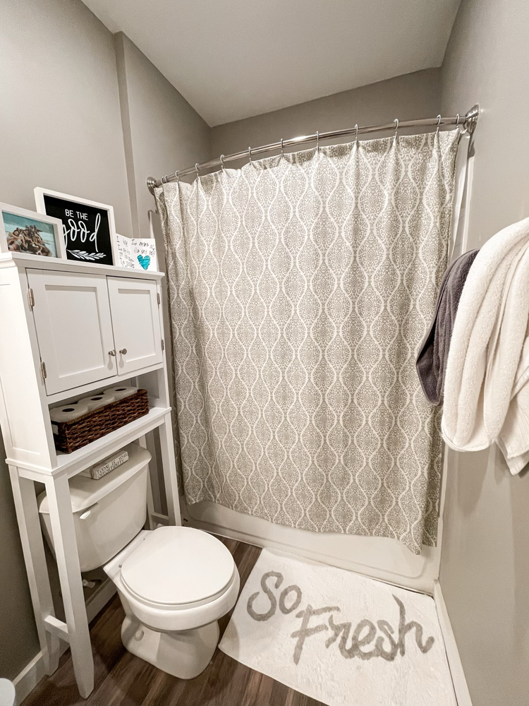 Bathroom with shower with curtain