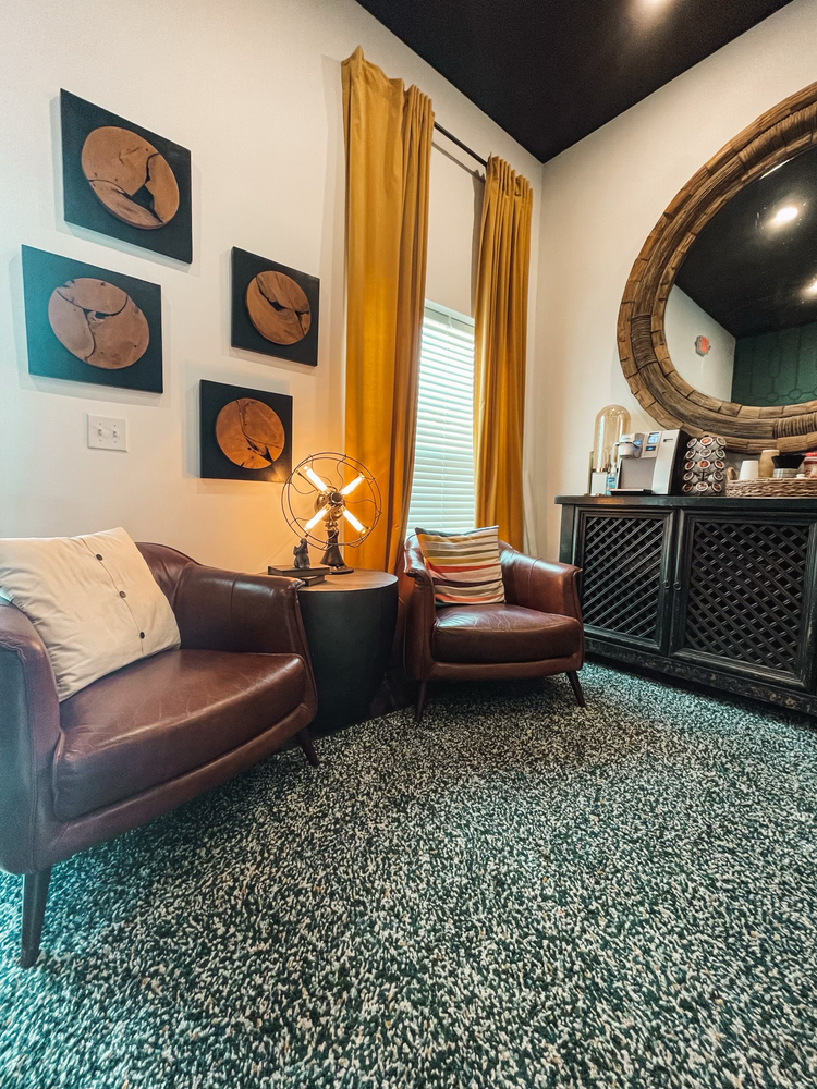 lounge area with chairs and coffee bar