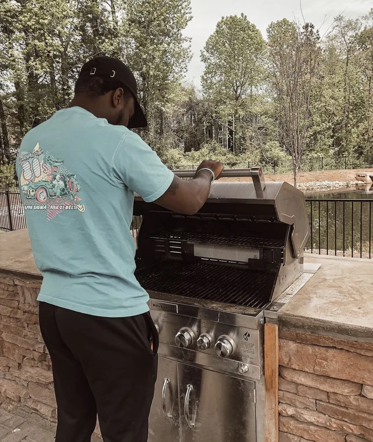 man at outdoor grilling area