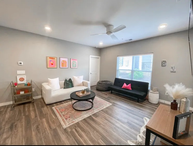 living area with sofas and table