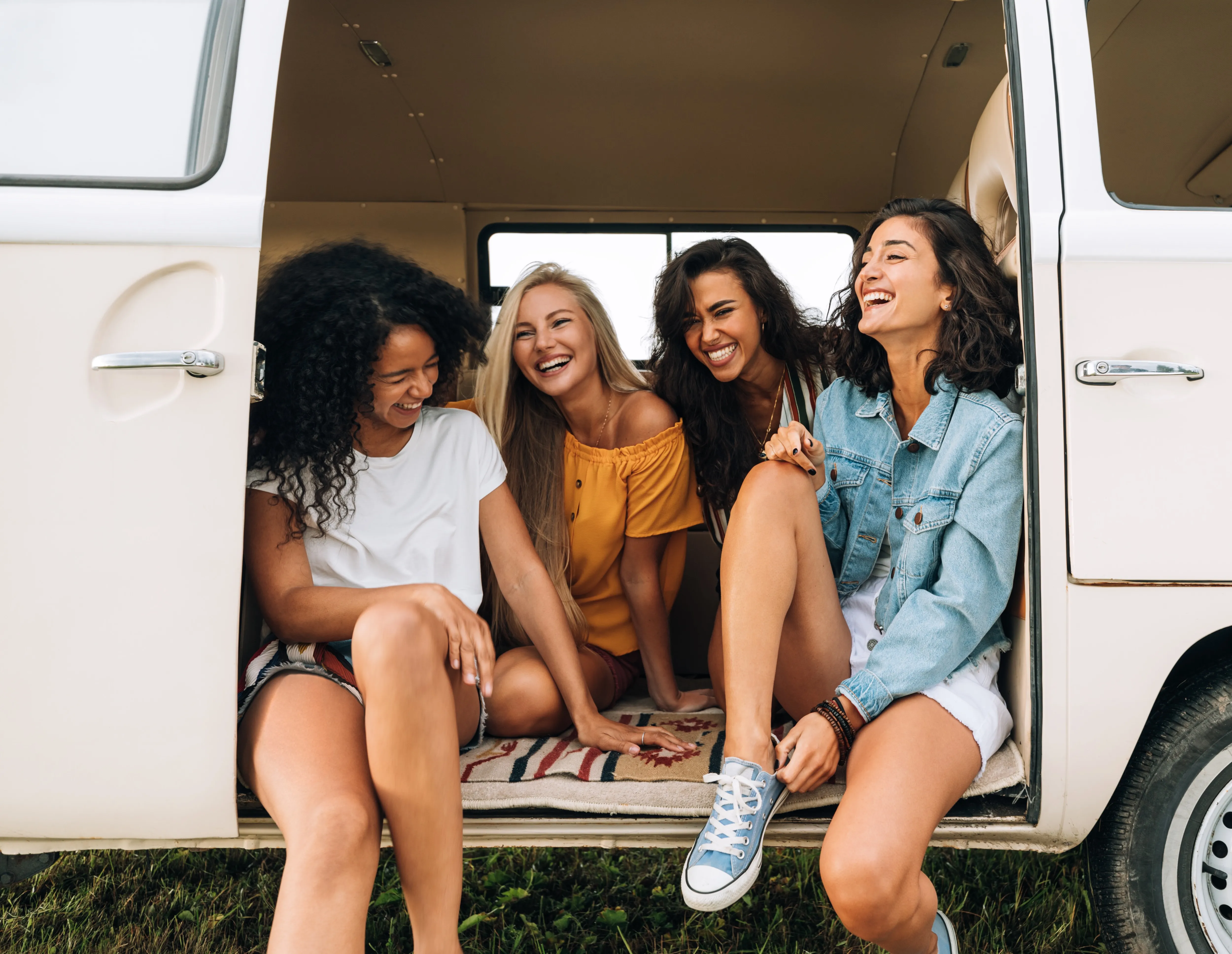 Group of friends sitting in van stock image