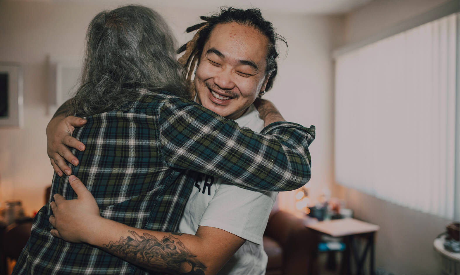 a volunteer hugs someone in need