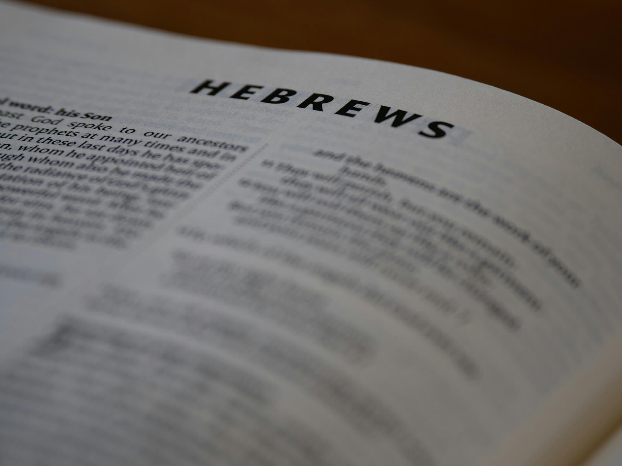 A picture of a bible opened to Hebrews