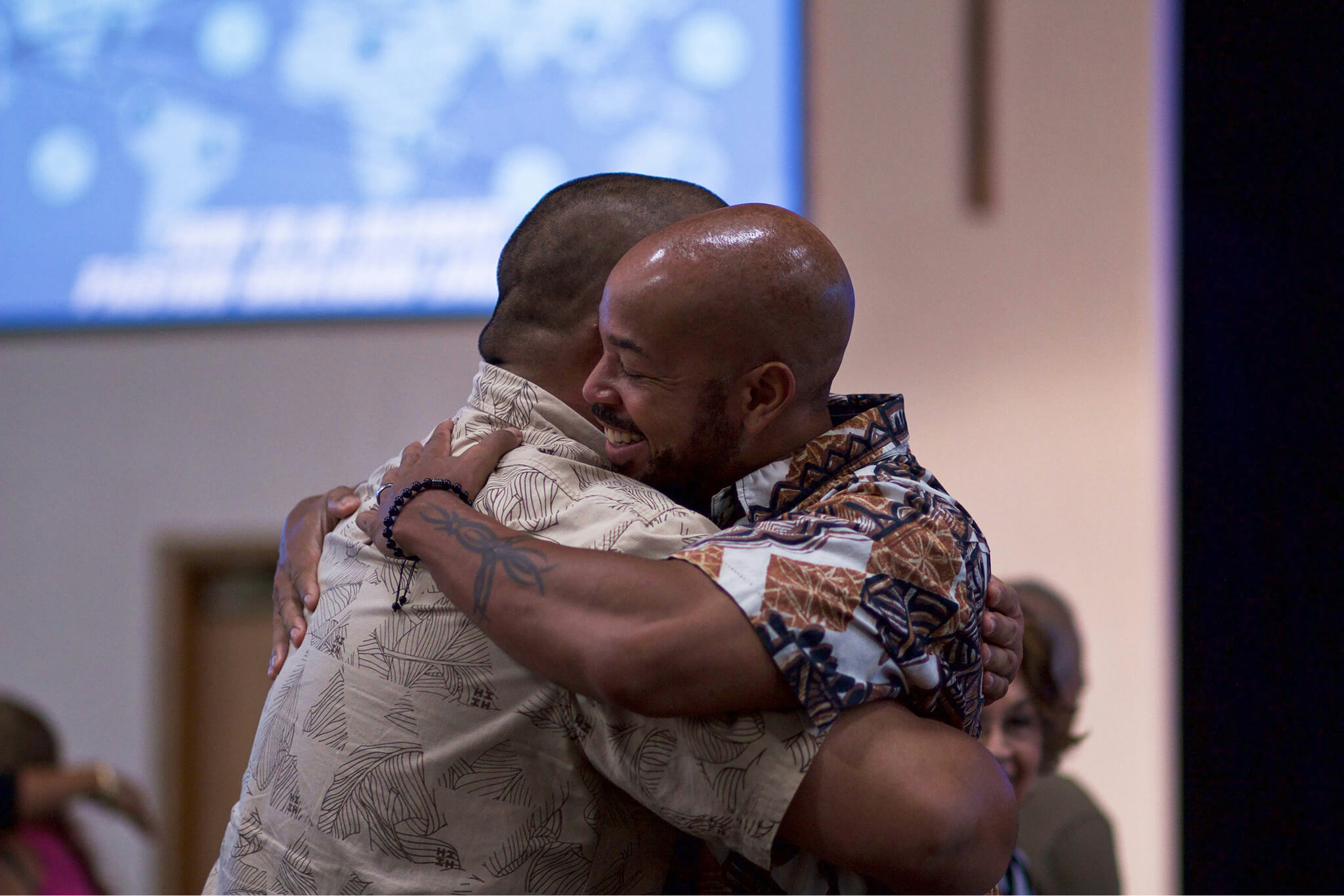 two friends embrace in a hug