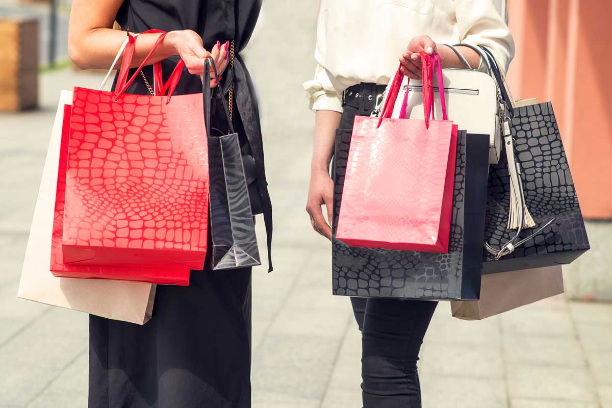 Shopping Addiction - Oniomania - When Buying Becomes a Compulsive Disorder - Women holding shopping bags