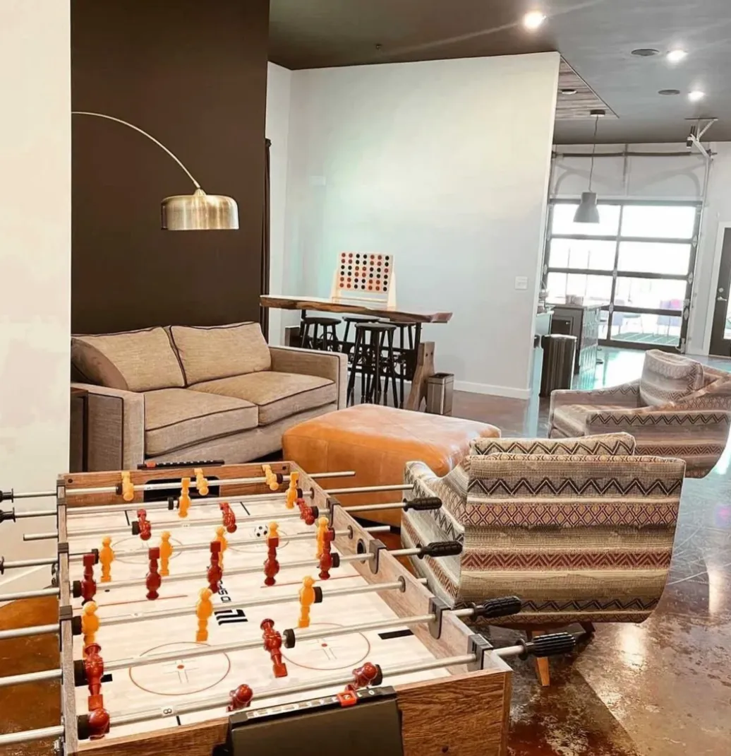 Clubhouse with foosball table and lounge seating