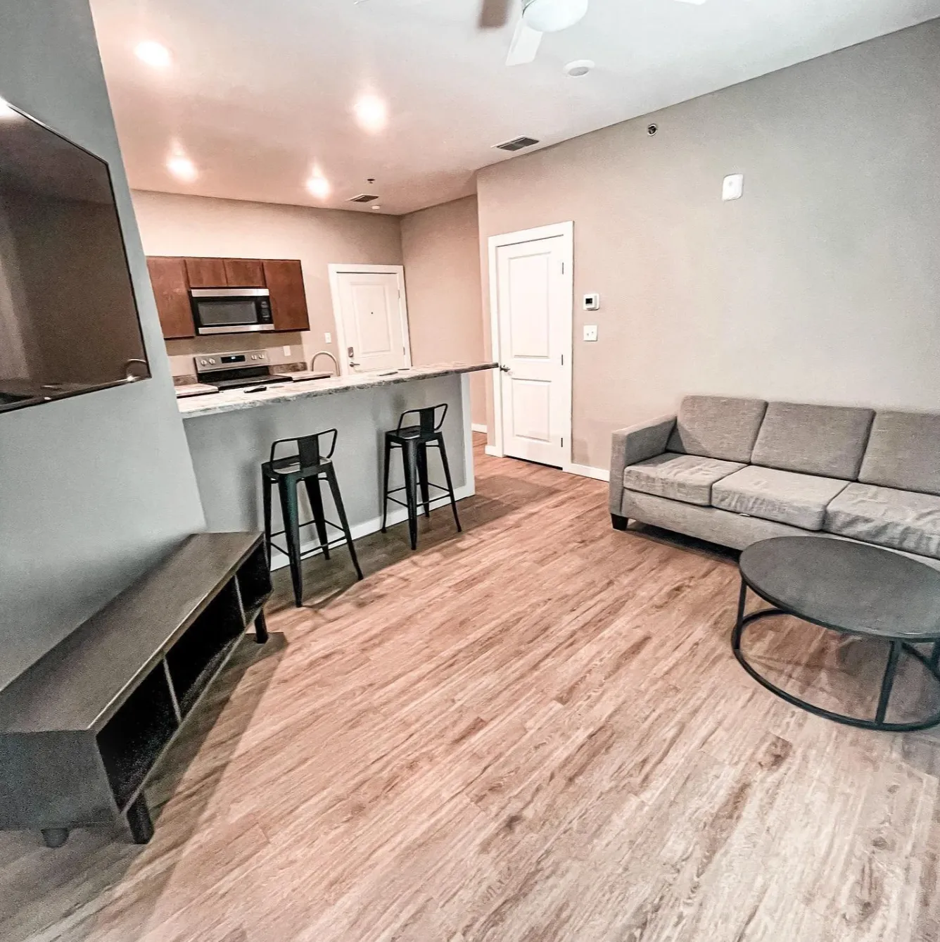 Furnished living area with Mounted 65" 4K HD Smart TV