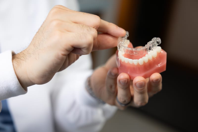 Invisalign clear aligners displayed at Medford Dental Wellness office in Medford, MA for orthodontic treatment