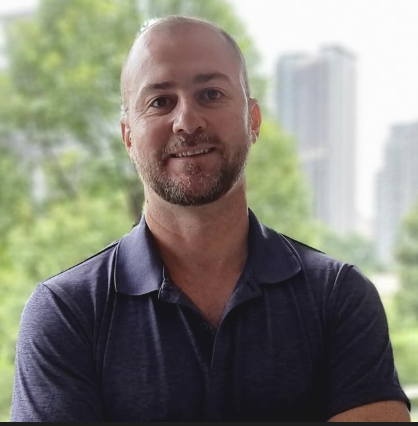 Simple black user profile icon with a circle for the head and a semicircle for the shoulders on a beige background.