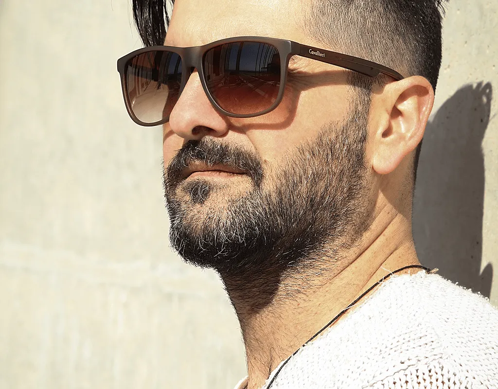 Man wearing designer brown gradient sunglasses with UV protection from opticians