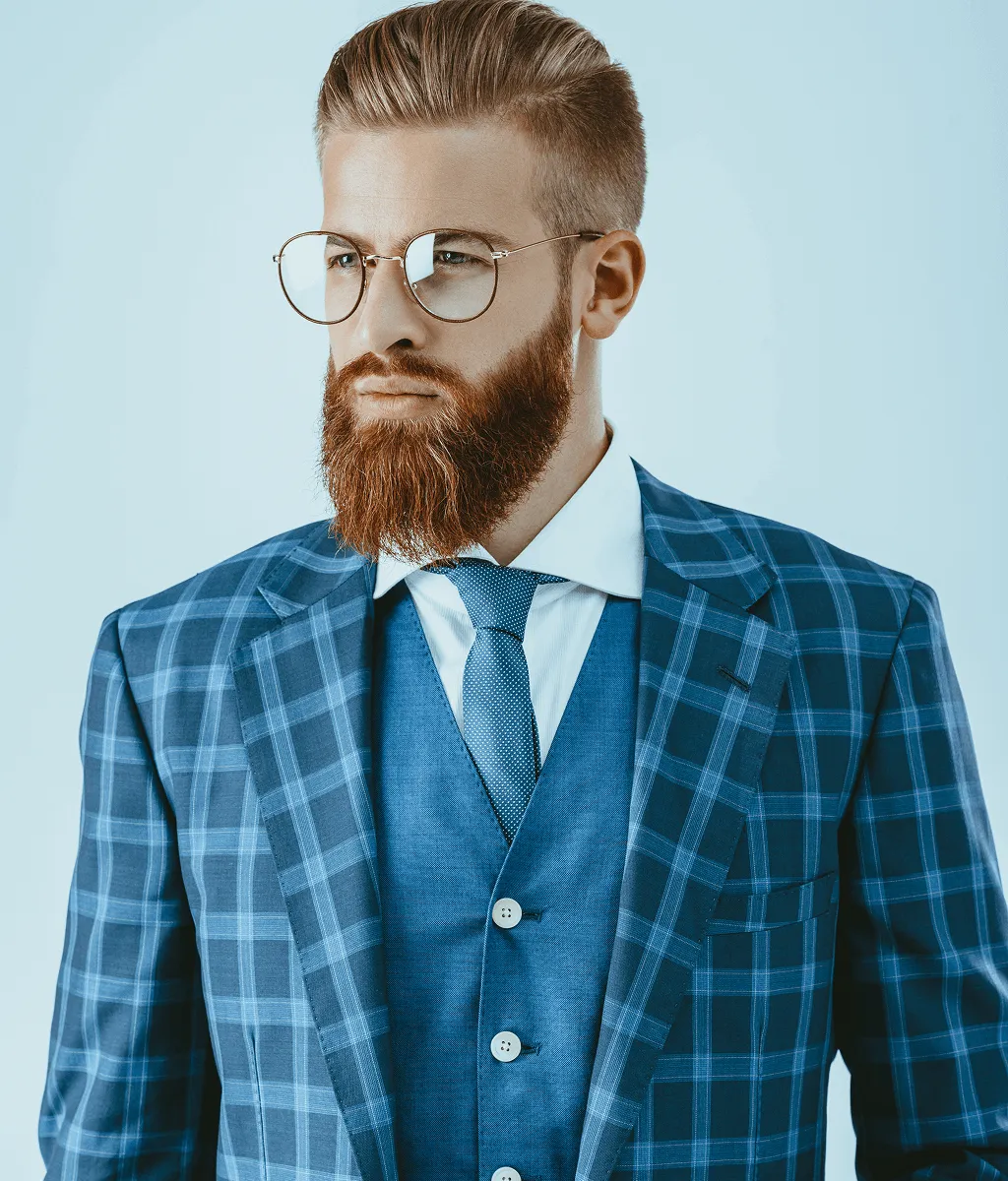 Man wearing stylish round metal prescription glasses frames from independent opticians