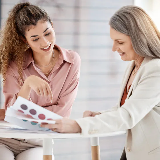 "Optician helping customer choose prescription lens options and coatings at independent opticians"