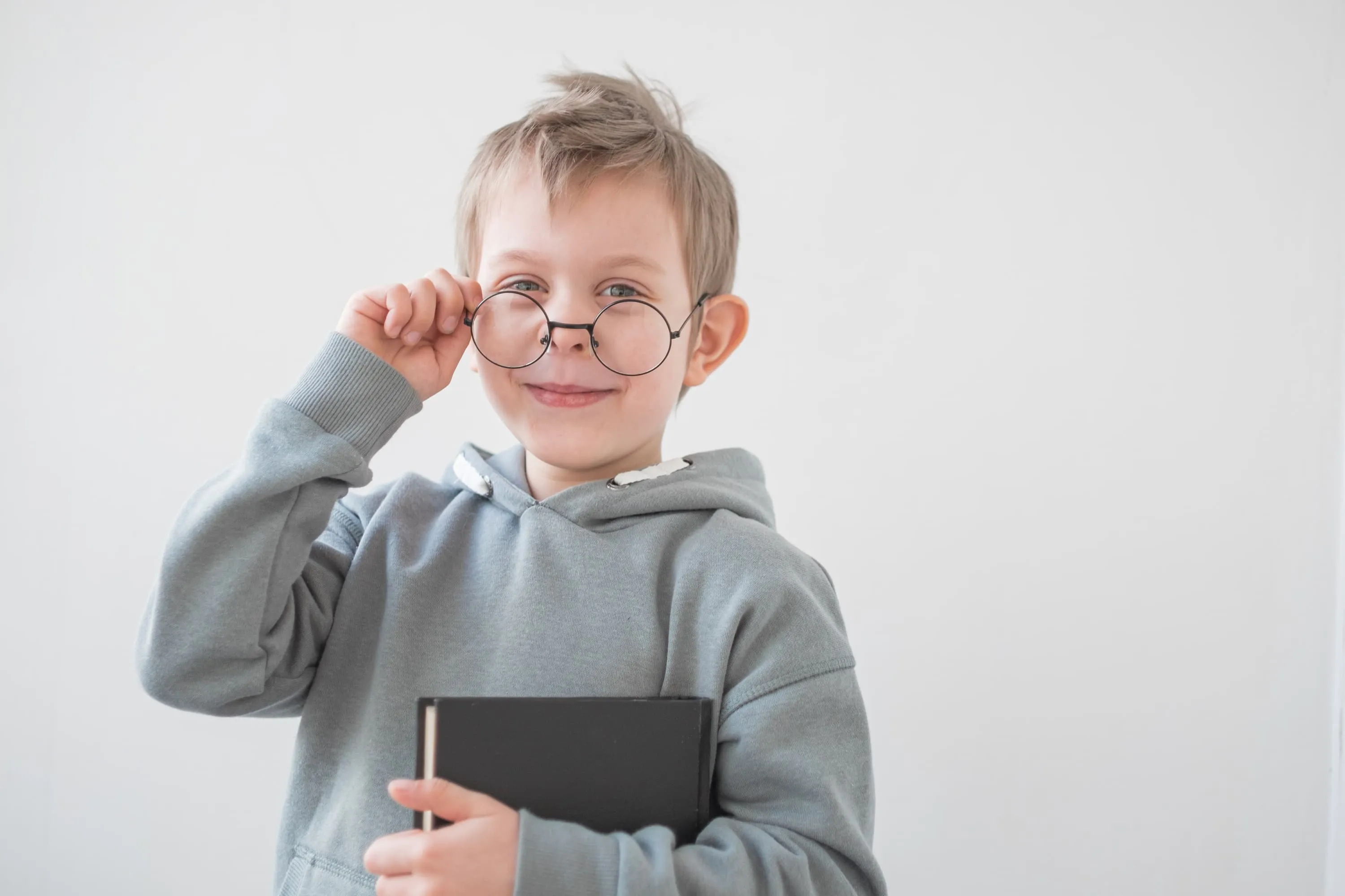 Optometrist performing a children’s eye examination using specialist eye testing equipment