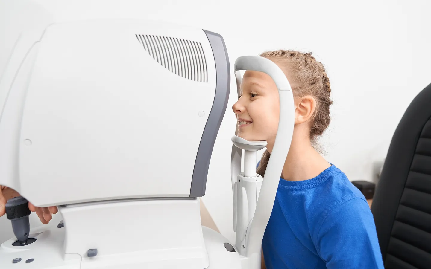 Confident child wearing stylish glasses, representing professional children’s eye care services