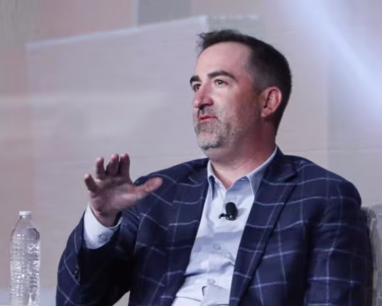 Kevin McElgunn, Partner at Withum, speaking on stage