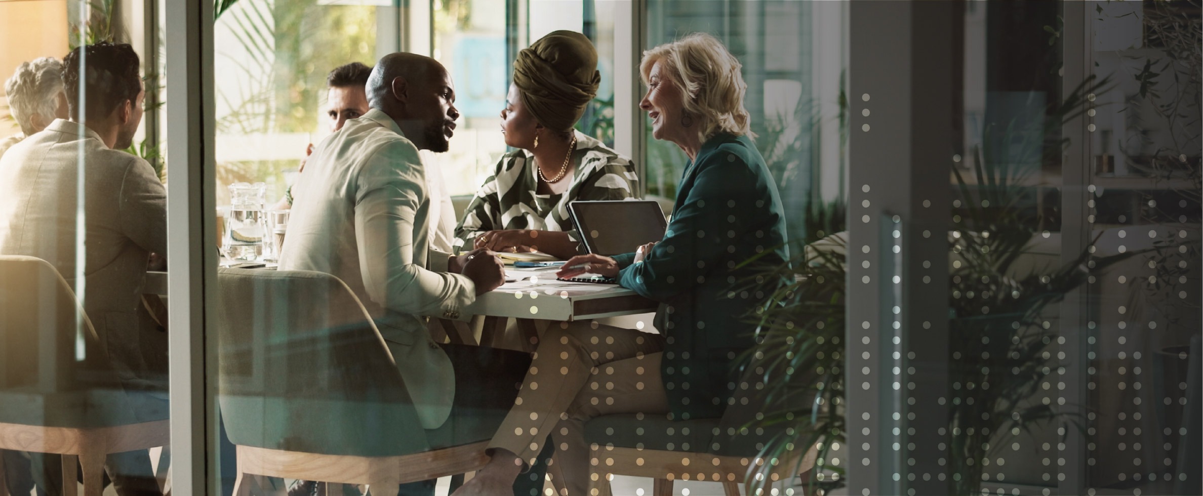 Finance team reviewing consolidated financial data in a boardroom, discussing group reporting and regulatory compliance.