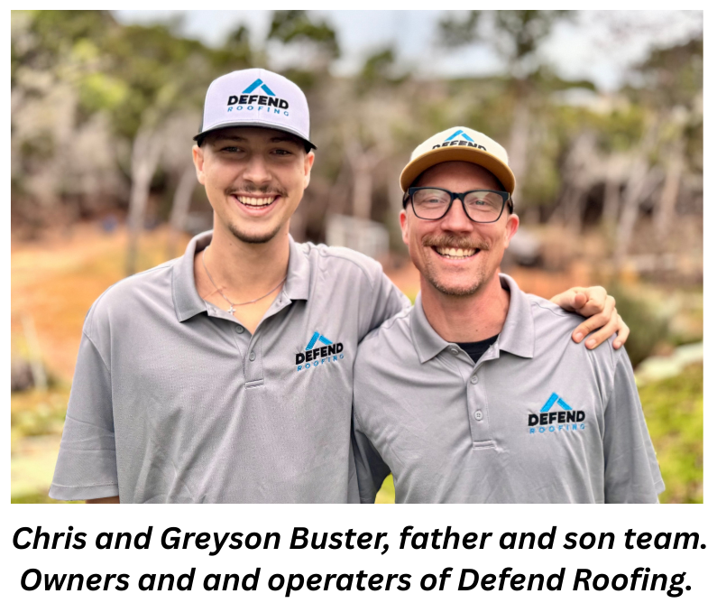 Two smiling men wearing Defend Roofing gray polo shirts and hats, standing outdoors with one arm around each other.
