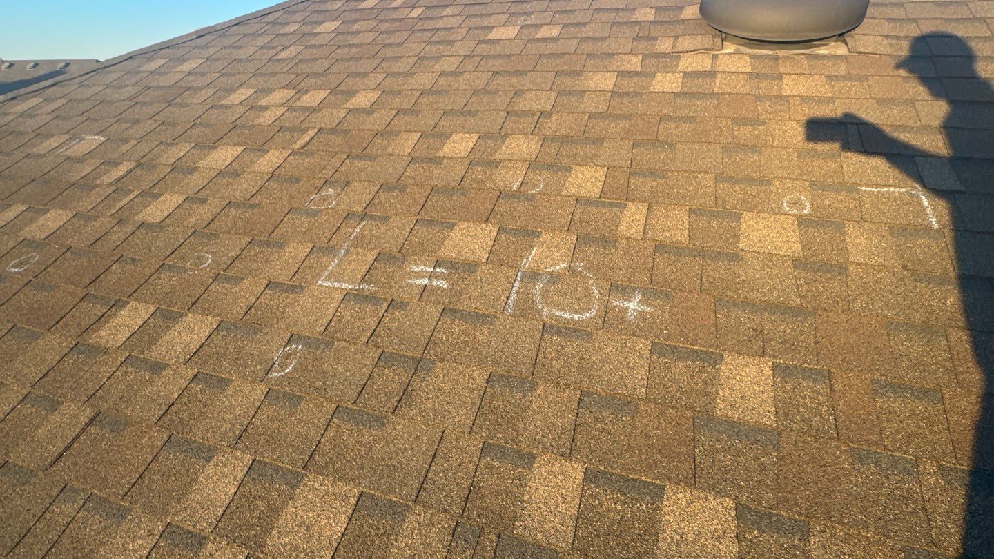 Hail test square with the impact count marked in chalk