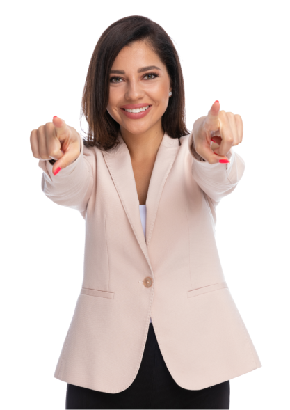 Smiling woman in beige blazer pointing forward with both hands.