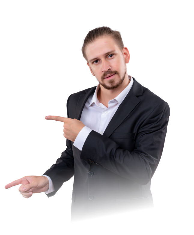 Man in black suit and white shirt pointing to the left with both hands.