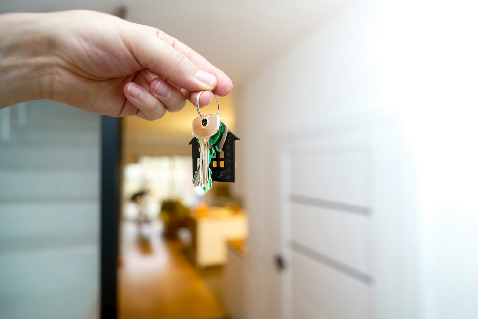 Holding the keys to a new home at the front door