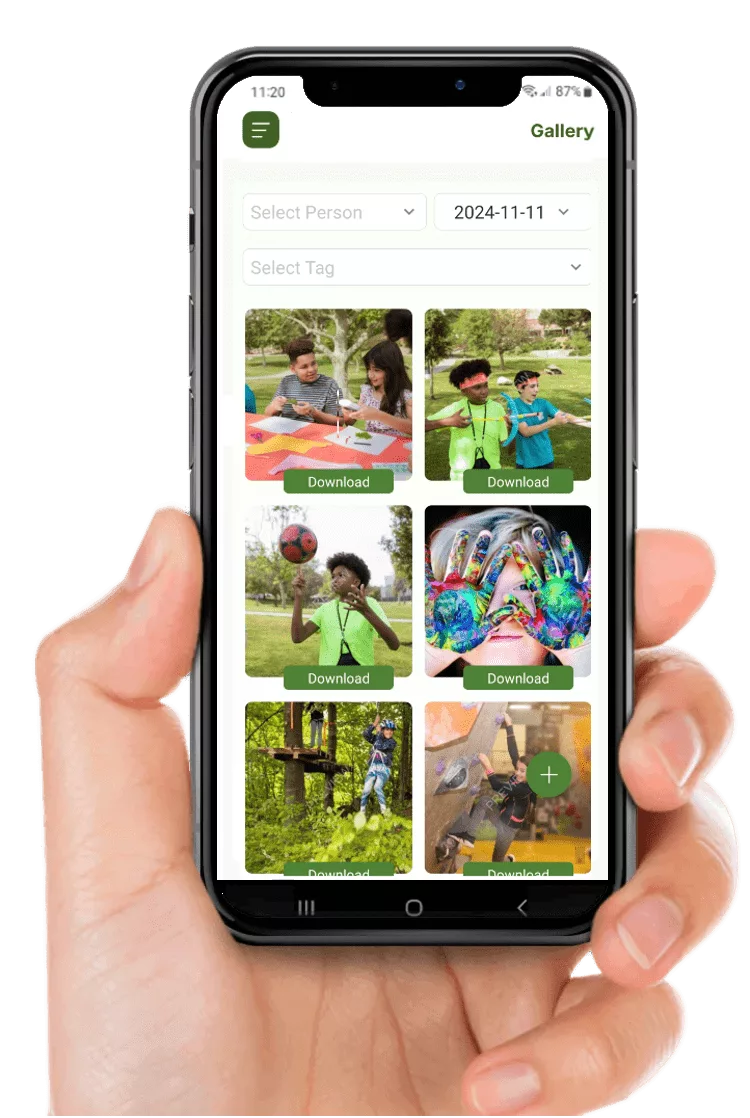 A hand with a mobile phone in it showing the Campium app photo gallery.