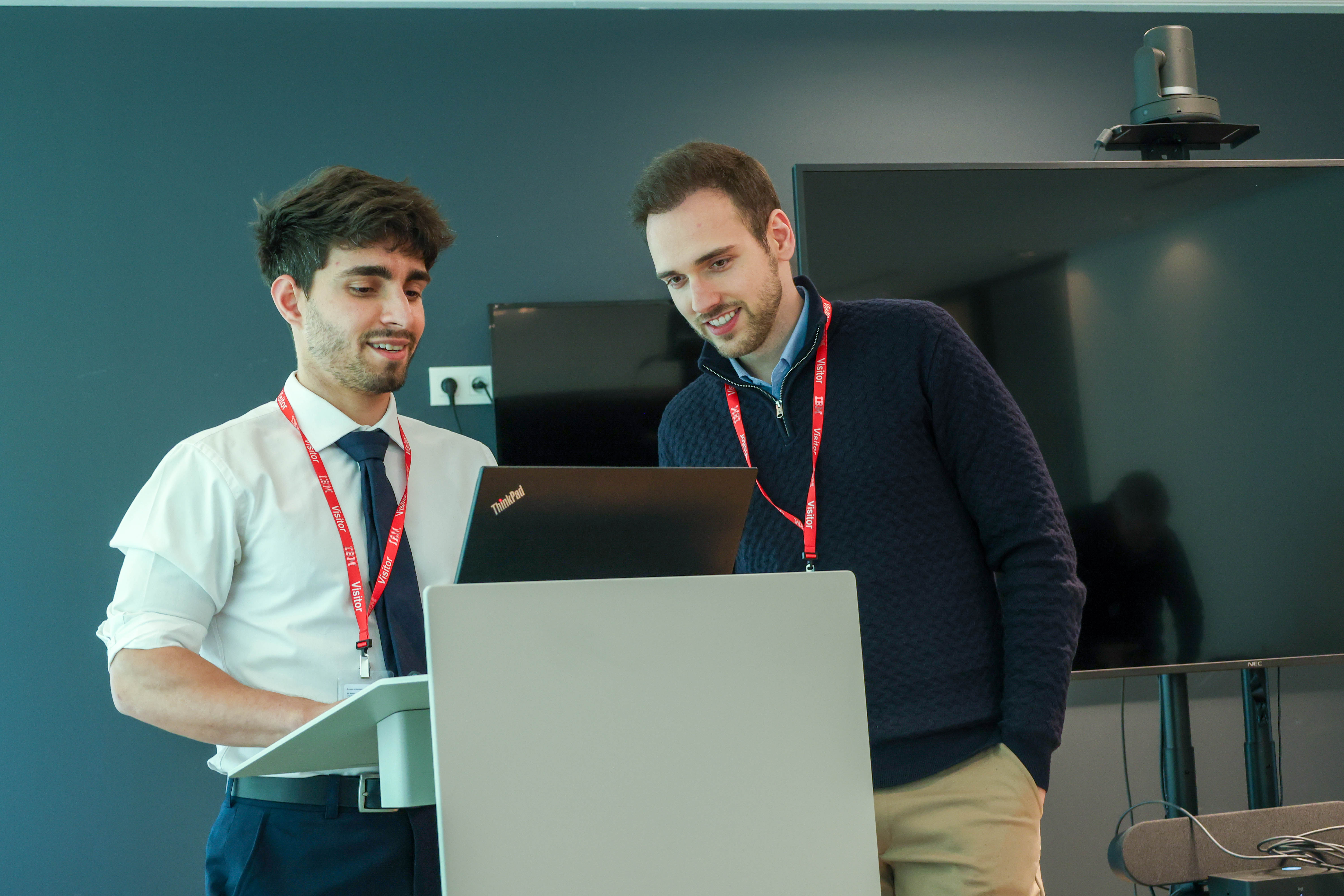 Group of adults engaged in a conversation at an IMUG event