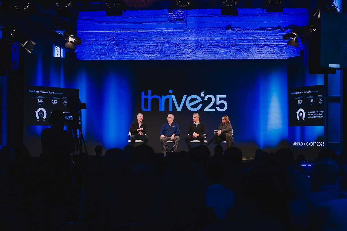Four corporate speakers presenting on stage at an annual sales kickoff event with Ten Events providing on-site production and hybrid webcast support