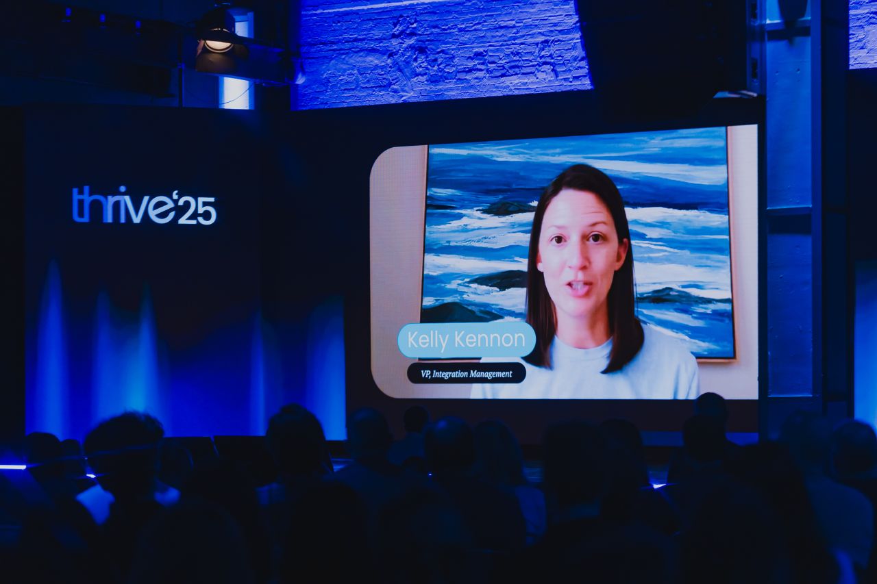 Hybrid event panel discussion with in-person audience and virtual analytics displays