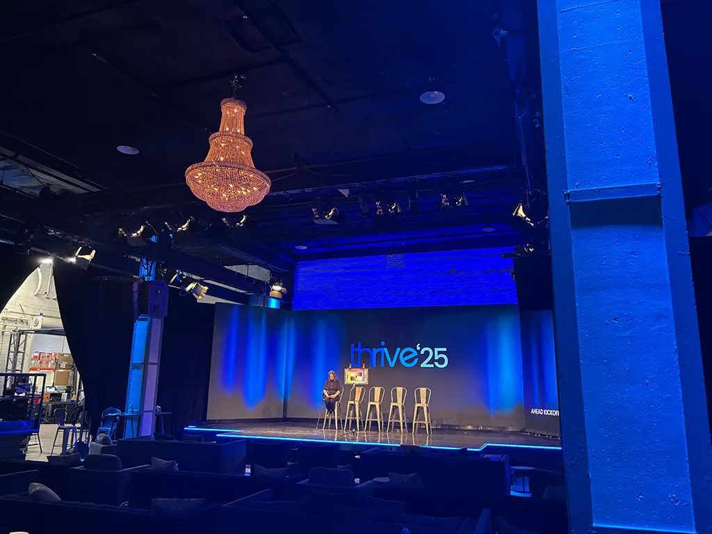 Professional stage setup with lighting and screens