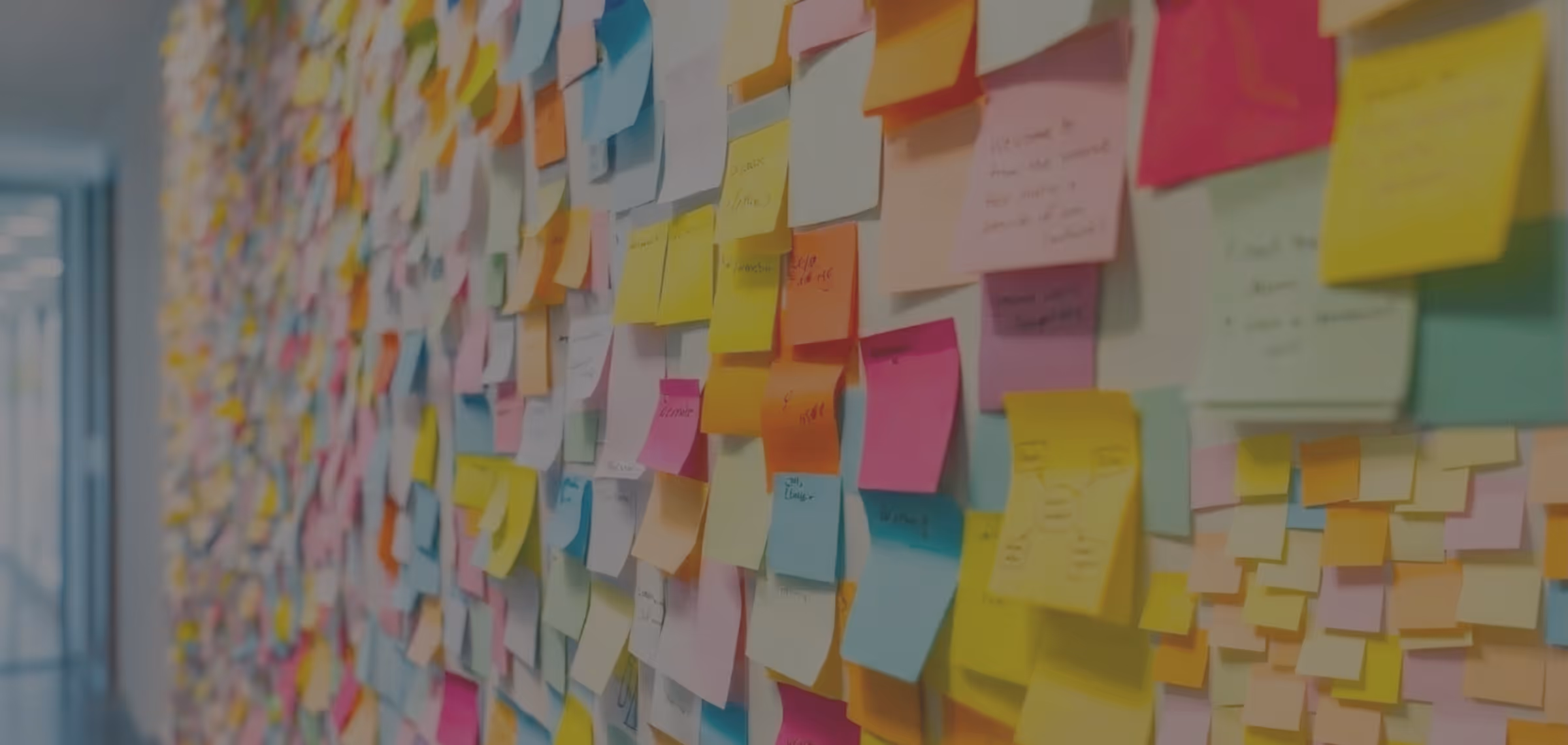 A wall of colourful post-it notes