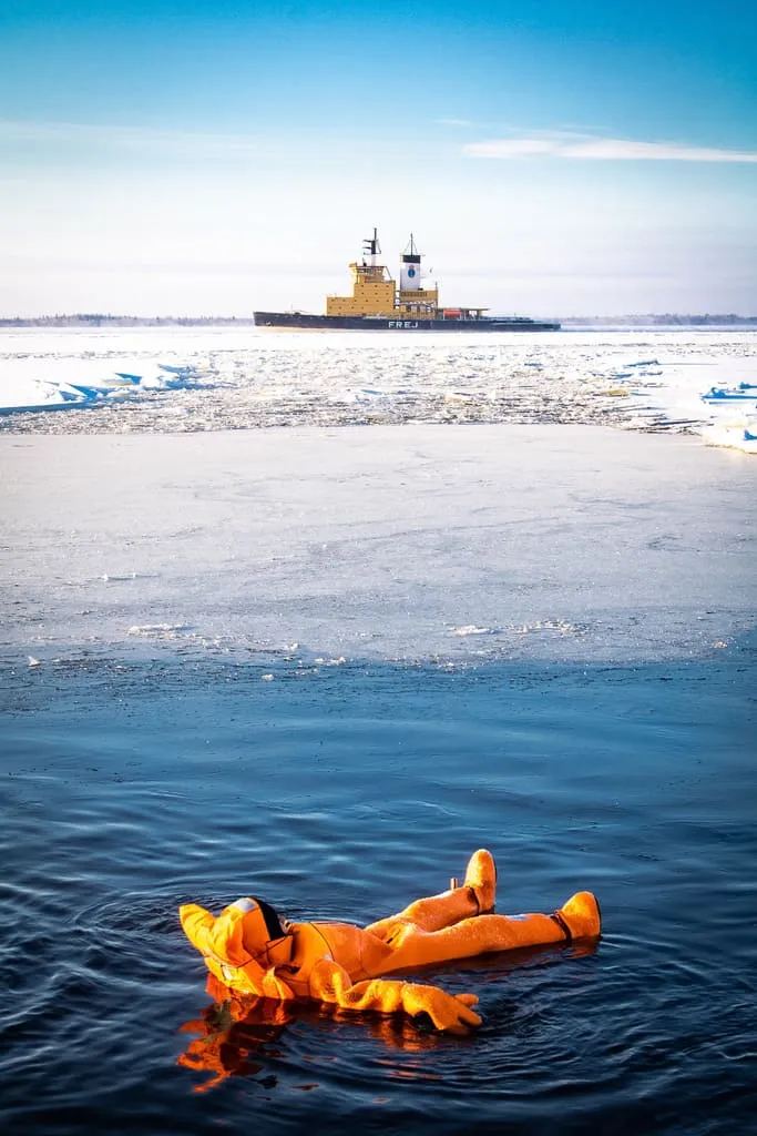 Guest ice floating in survival suit aboard Polar Explorer expedition