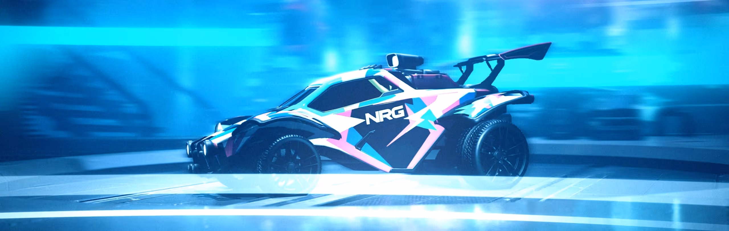 Side view of a stylized black and colorful race car with NRG logo against a blurred blue background.