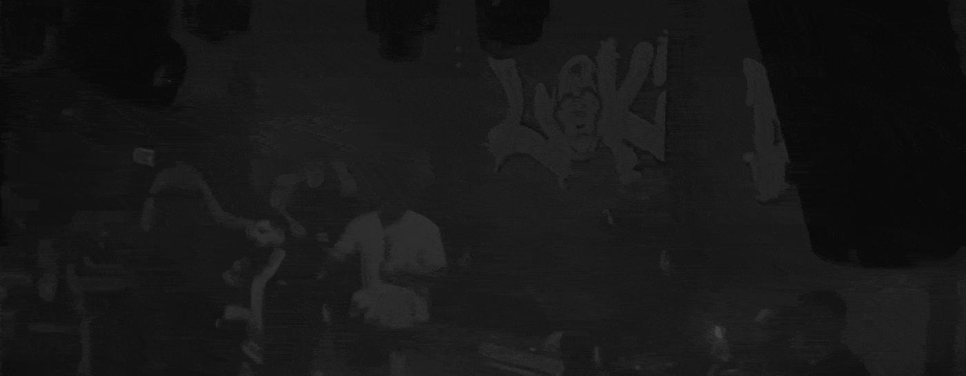 VOID Logo Animation on a background with people socializing in a dimly lit room with graffiti and a neon sign reading 'LOKI' on the wall.