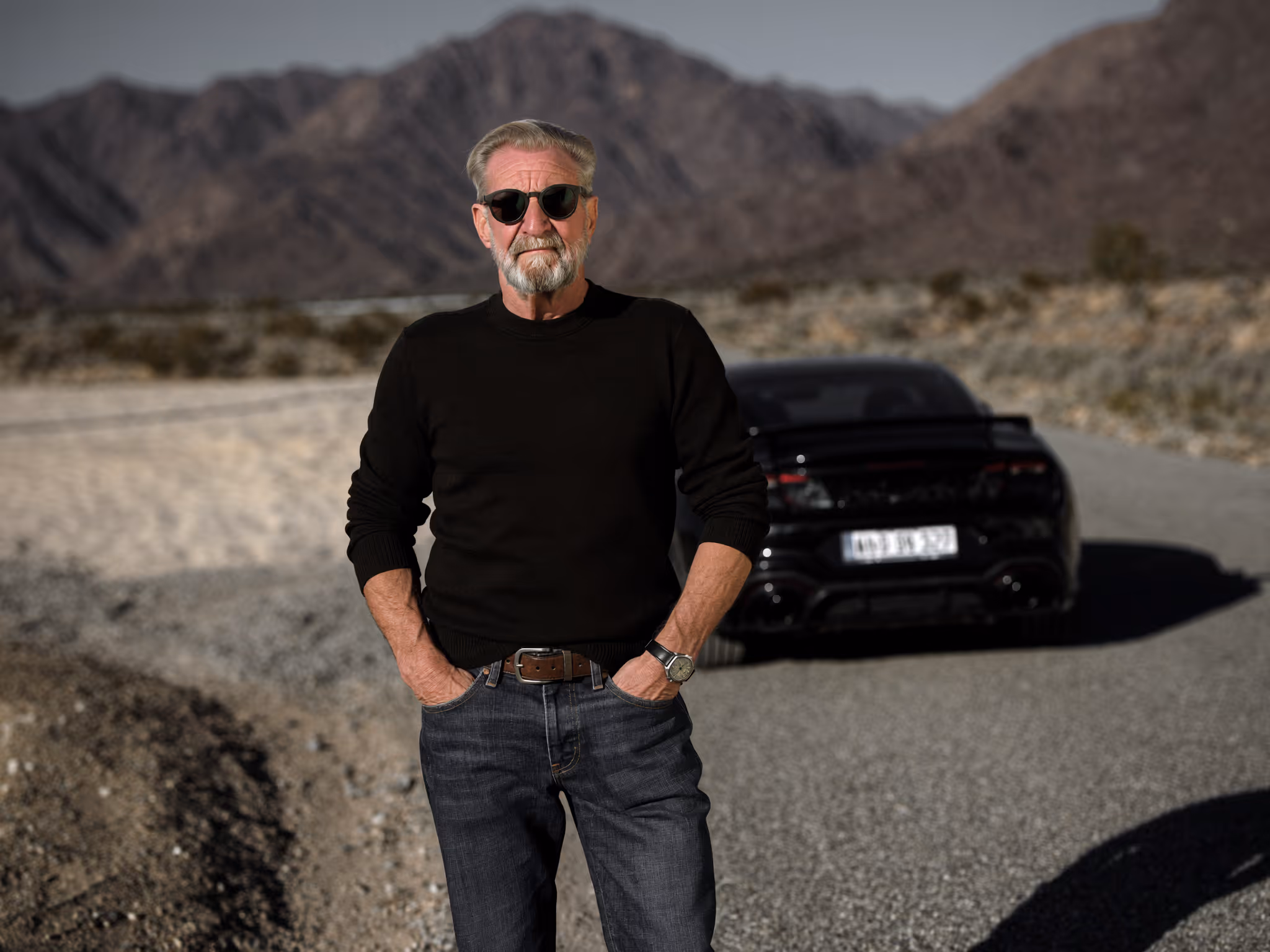 Gary Paulzak looking muscular in front of a muscle car