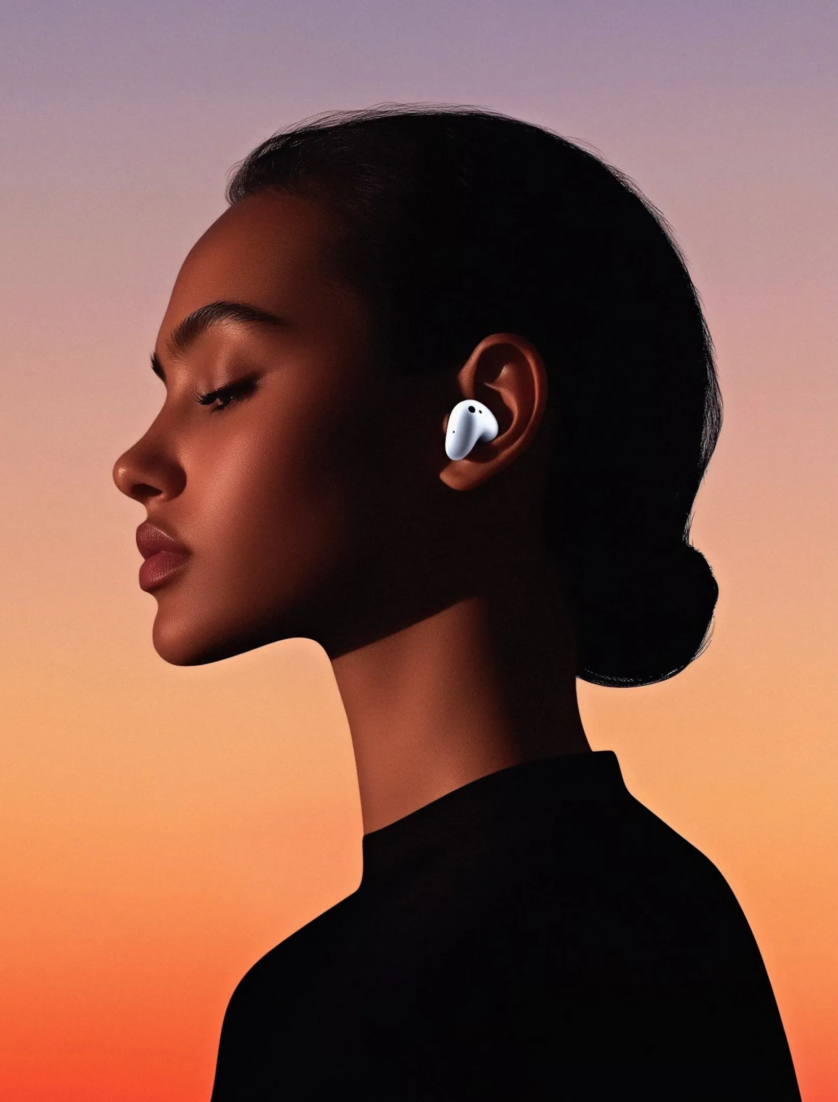 Profile of a woman with dark hair in a bun wearing a white wireless earbud, set against a gradient sunset background.