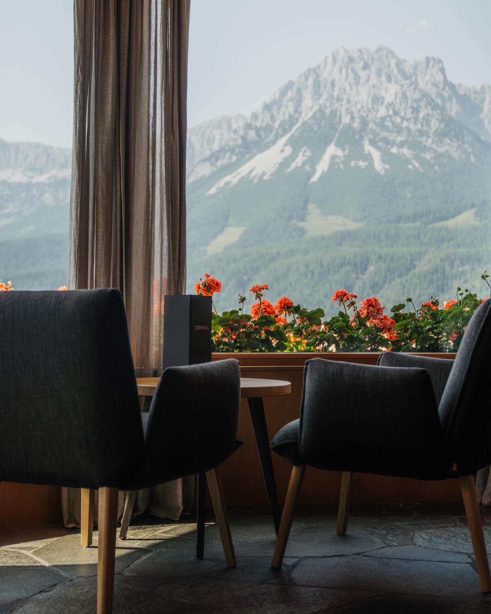 restaurant table with mountain view through window