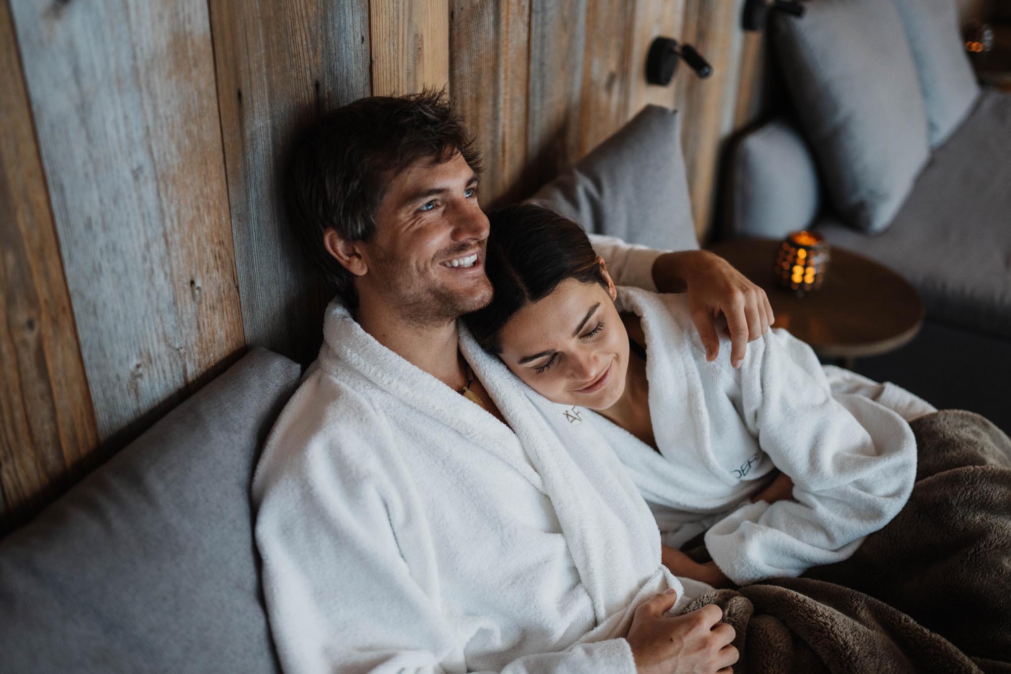 guests relaxing in bed in boutique hotel room