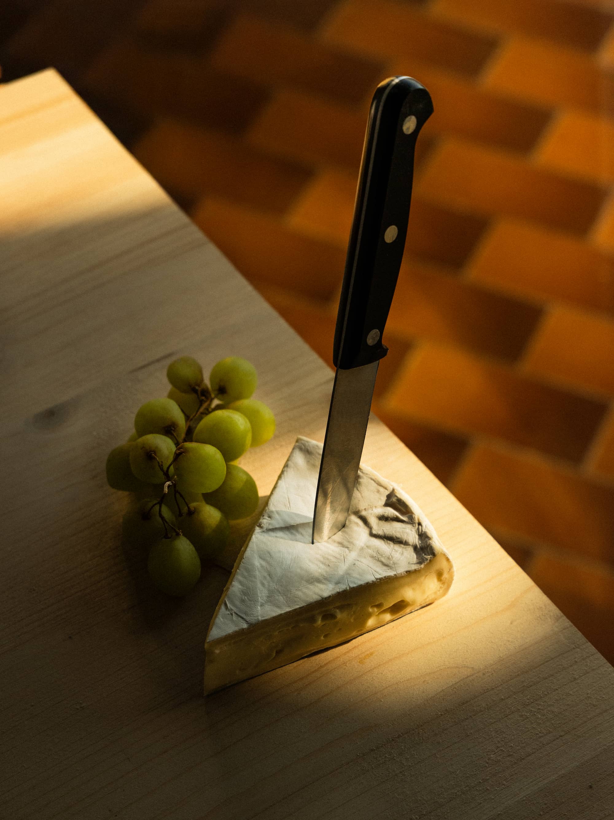 kitchen detail with knife and ingredients in warm light