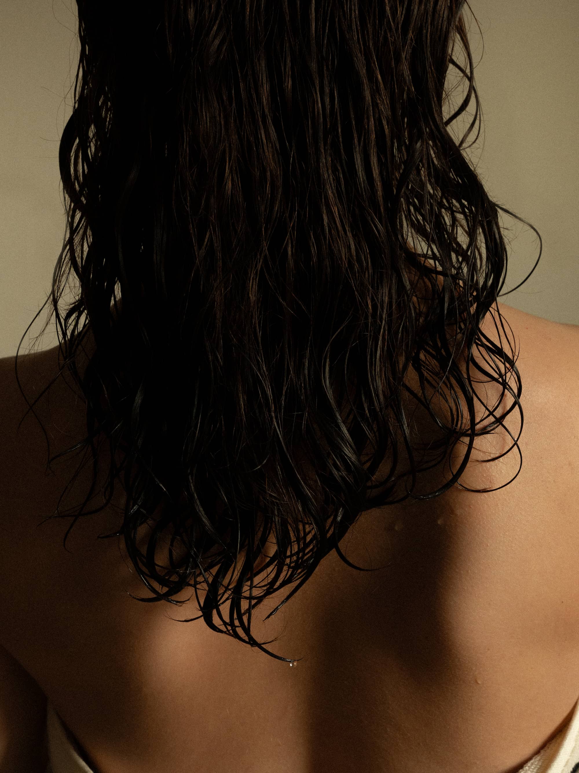 wet hair detail on skin in warm natural light