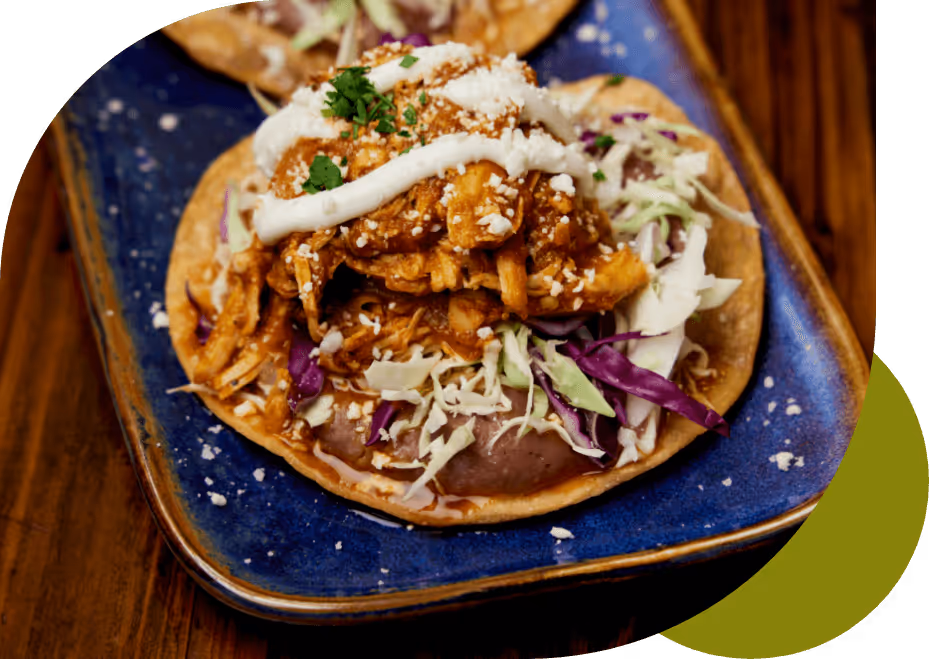 Corn tortilla chipotle stewed chicken, sea beans, cabbage, sour cream, queso fresco.