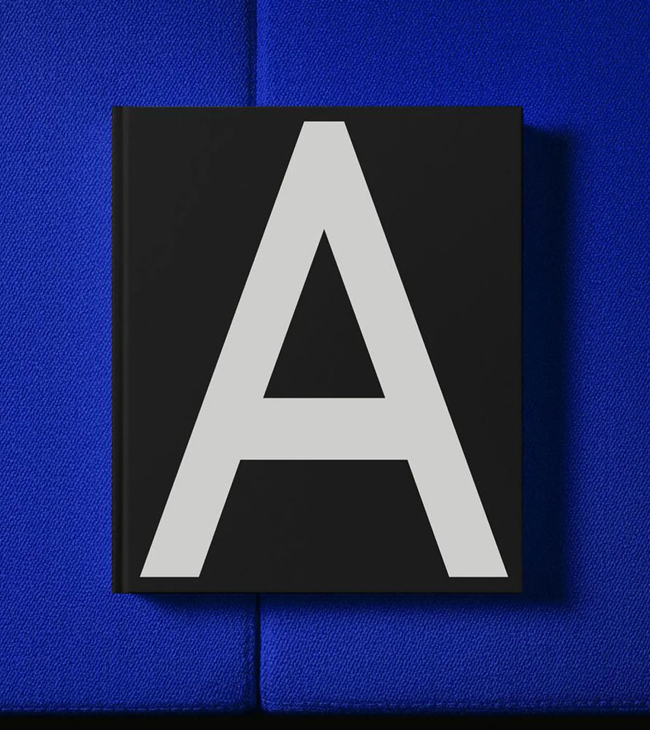 A black and white book featuring the letter 'A' prominently on its cover.