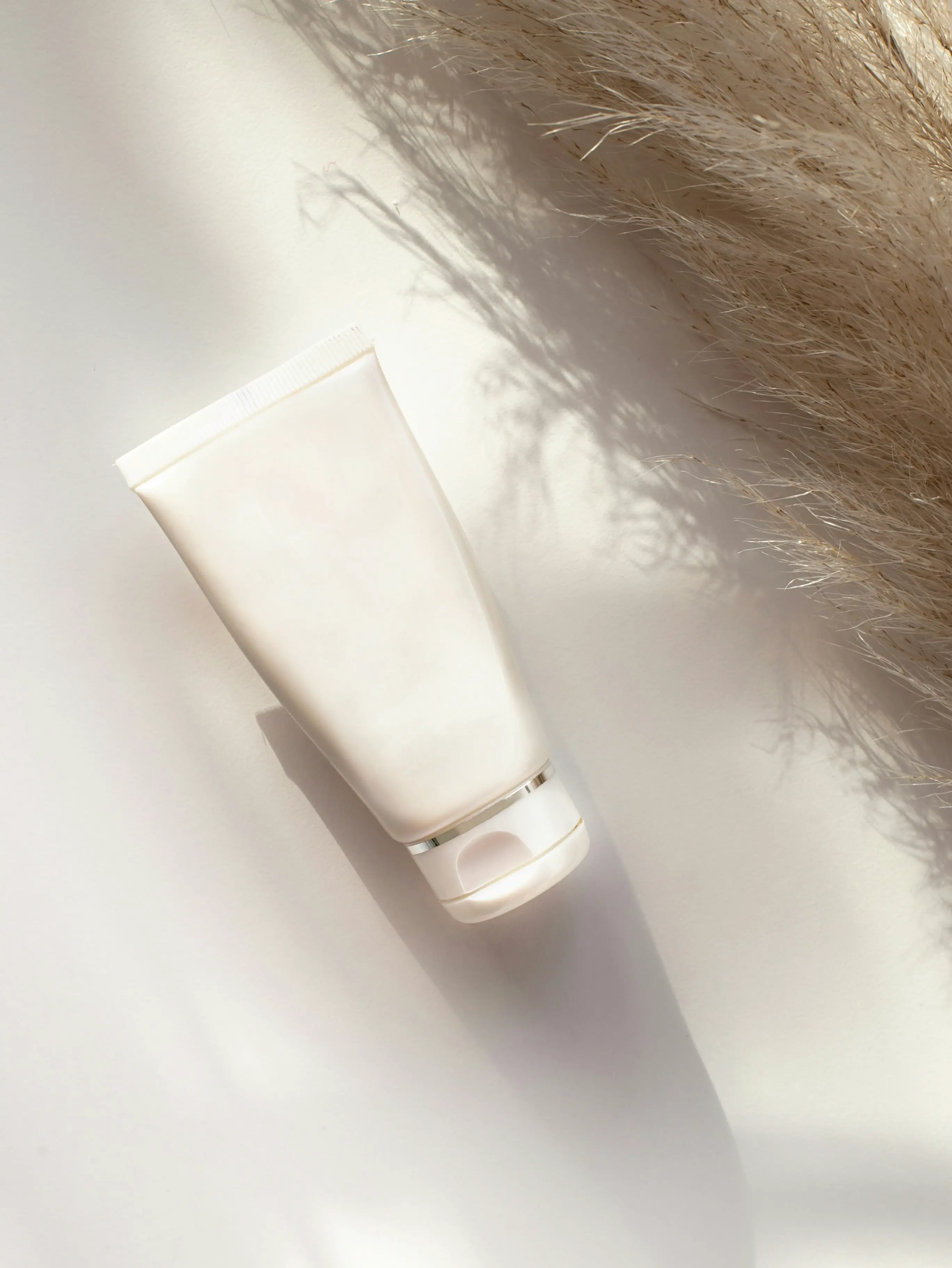 A silver sculpture featuring engraved words, reflecting artistic expression and thoughtful design.