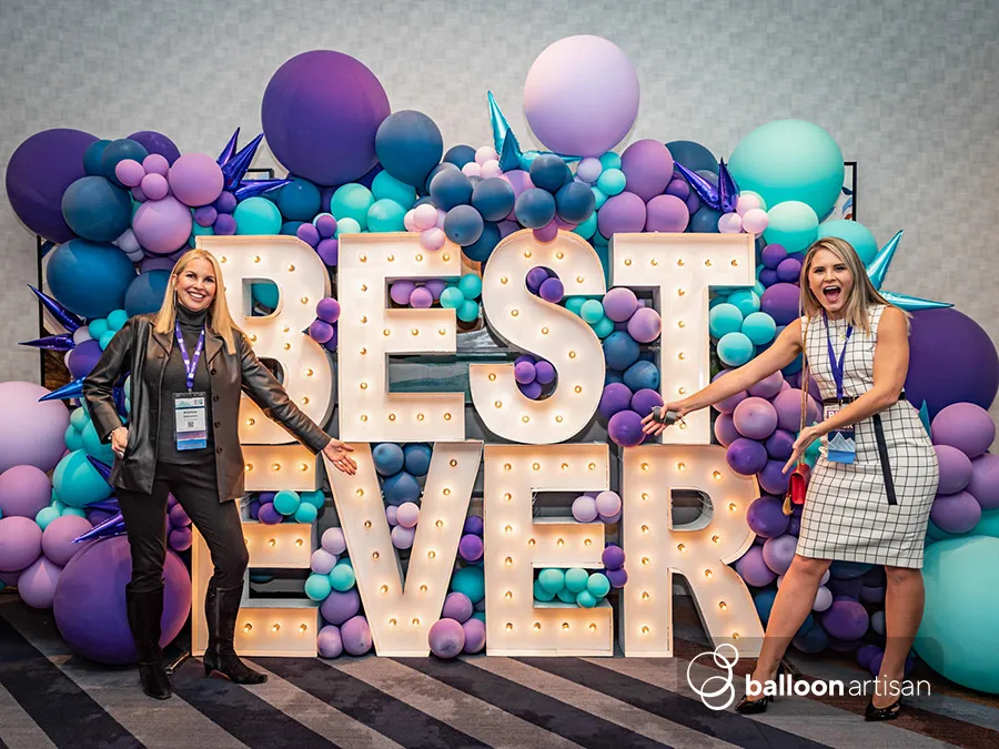 A balloon arch for a grand opening ribbon cutting ceremony for a brand launch.