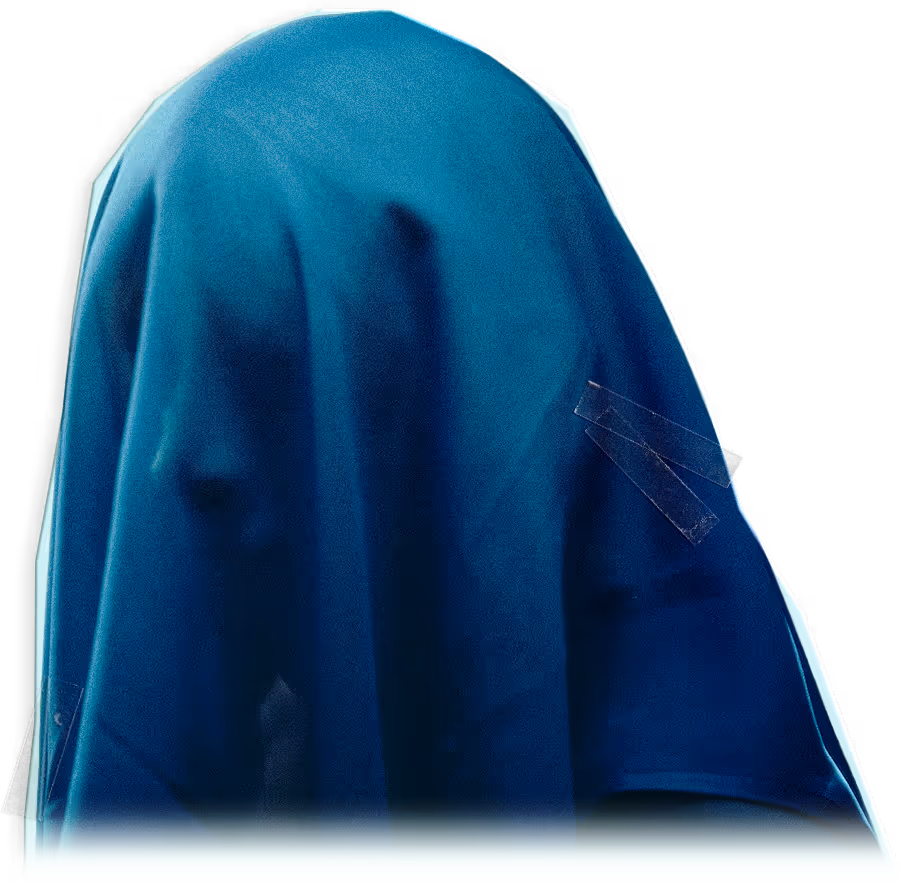 Two faces partially visible under a blue cloth against a black background.